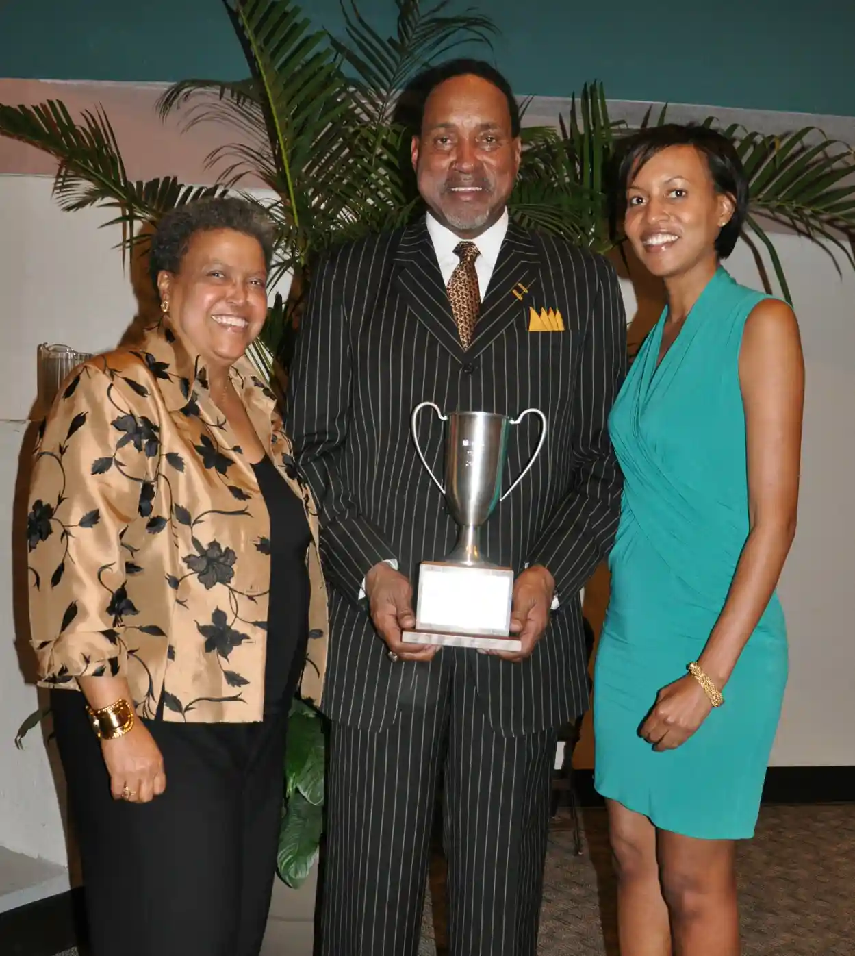 Image of George Tinsley receiving Business Man of the Year Award.